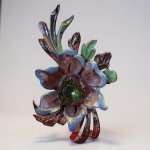 Vintage lightweight floral brooch with green center rhinestone